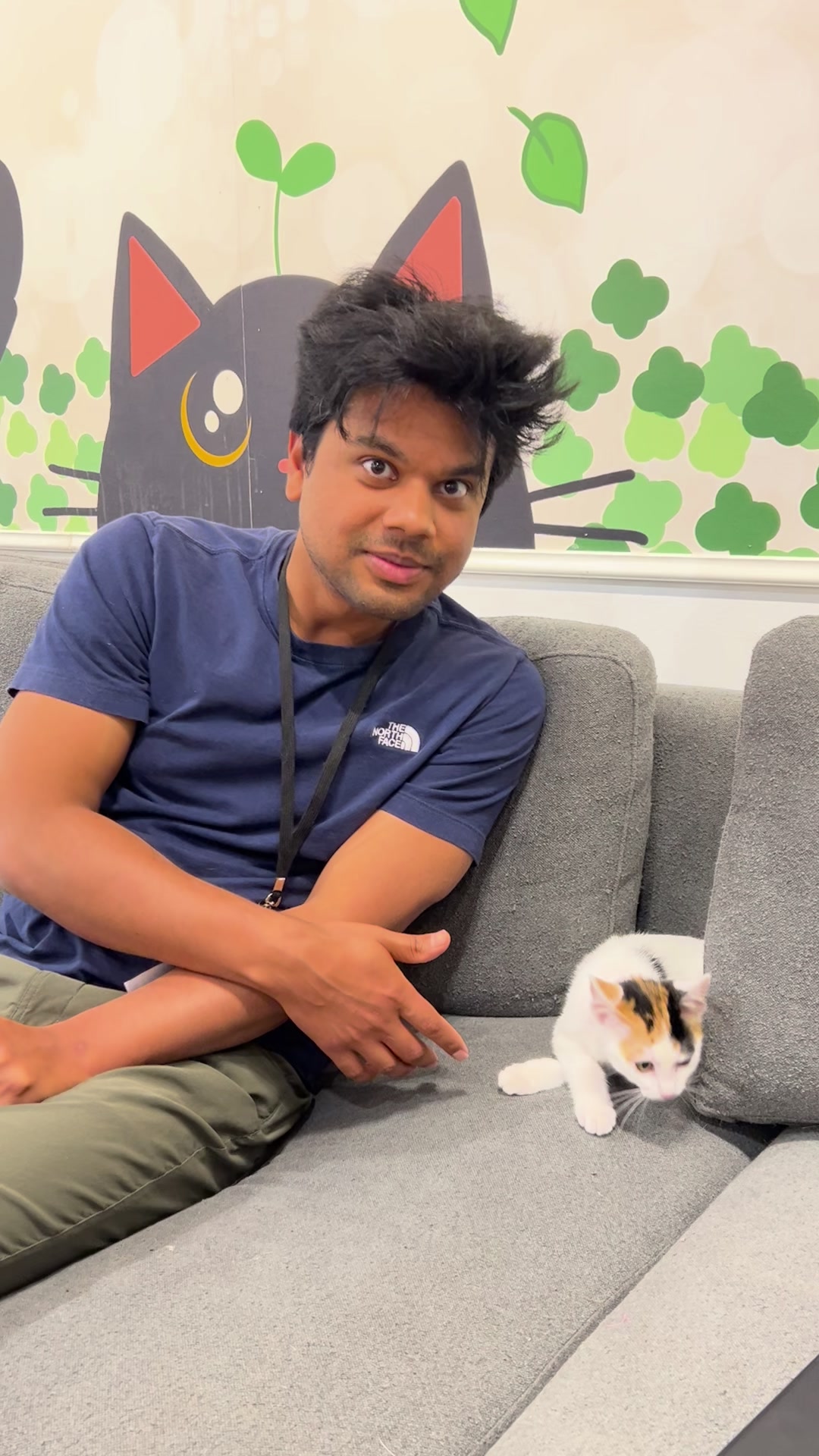 Mayank Singh sitting beside a kitten